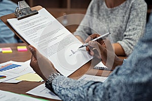 African businessman signing documents