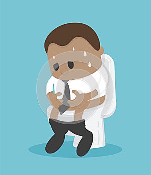 African Businessman sitting on the toilet with his stomach ache and possibly a bowel disease