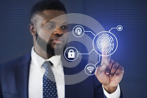 African Businessman Touching Virtual Panel For Fingerprint Scanning, Blue Background