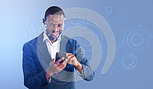 African businessman using smartphone, hologram with biometric sc