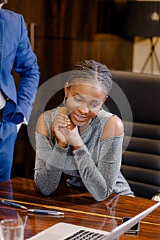 African businesswoman look at camera in boardroom