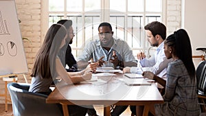 African ceo lead negotiations with diverse business partners in boardroom photo