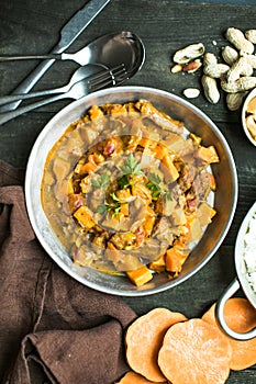 African chicken peanut stew with sweet potatoes with side of basmati rice