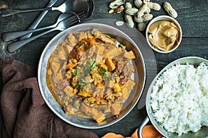 African chicken peanut stew with sweet potatoes with side of basmati rice