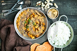 African chicken peanut stew with sweet potatoes with side of basmati rice