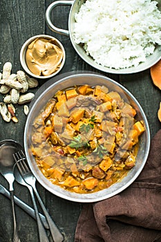 African chicken peanut stew with sweet potatoes with side of basmati rice