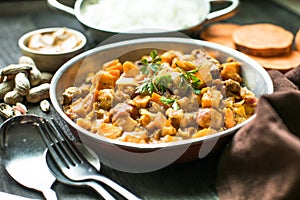 African chicken peanut stew with sweet potatoes with side of basmati rice