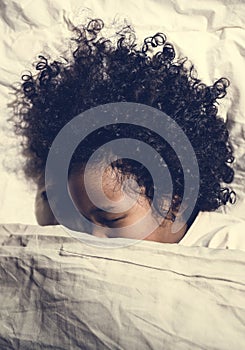 African child sleeping alone quietly