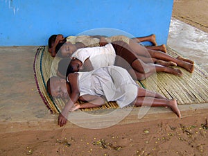 African children sleeping on the floor