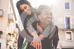 African couple having fun outdoor in city tour - Young people lovers enjoying time together during vacation journey - Love,