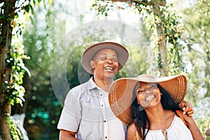 African couple, hugging and portrait in backyard for relax or unwind on day off for holiday outdoor. Man, woman and