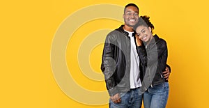 African Couple Hugging Posing Wearing Black Leather Jackets, Studio Shot