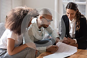 African couple meet with notary or lawyer discuss prenuptial agreement photo