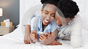 African couple, pregnancy test and planning for baby together in home, talking about happy news on bed and conversation