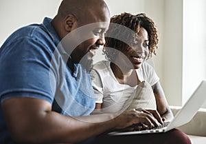 A african couple using digital device