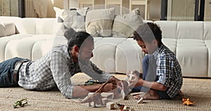 African dad play wooden cubes with little son