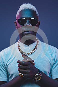 African dandy with white hairs against dark background