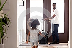 African daughter running to meet father returned from business trip