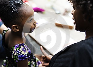 African descent girl is listening to her teacher