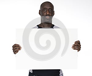 African descent man is holding a placard
