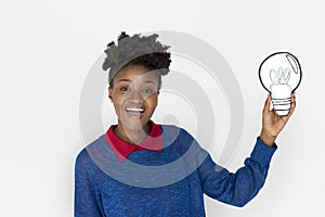 African Descent Woman Holding Light Bulb