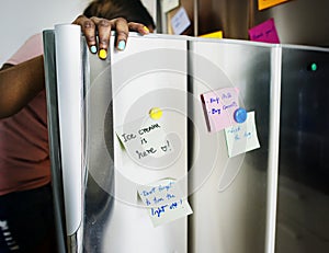 African descent woman open the fridge