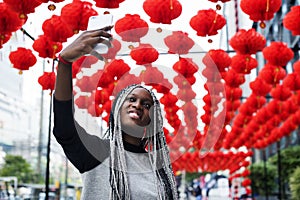 African descent woman selfies with red lamp