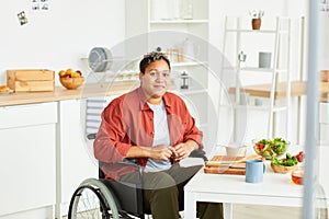 African disabled woman in the kitchen