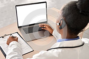 African doctor talk to patient by online webcam video call on laptop screen.