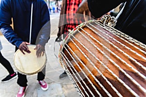 African drummers blowing their bongos on the street