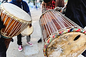 African drummers blowing their bongos on the street