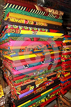 African fabric, kitenge, displayed in a shop along a street in Accra, Ghana