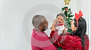 African family, 4-month-old Nigerian baby newborn son, father and mother smiling and happy together