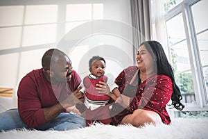 African family, 4-month-old Nigerian baby newborn son and father, smiling and happy together