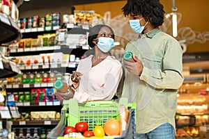 African Family Couple Choosing Food Doing Grocery Shopping In Supermarket