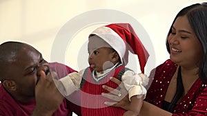 African family, Nigerian father and Asian mother playing with their baby newborn son