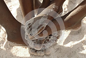 African feet in the sand