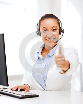 African female helpline operator showing thumbs up