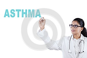 African female physician writing asthma word