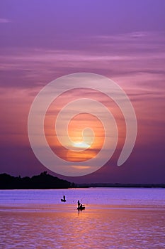 African fishermen at sunset photo