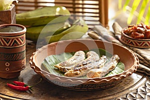 African food. African cuisine called Boli and sauce. fried bananas plantains. Grilled Bananas. African tourism photo