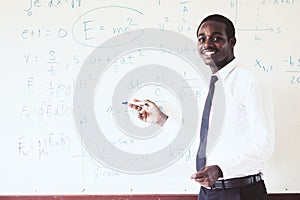 African foreign teacher teaching  science in the classroom