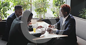 African friends talking in a cafe
