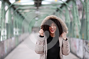 African girl with curly hair smiling