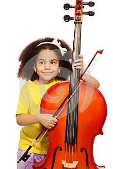 African girl holding violoncello and playing photo