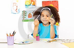 African girl holds cuisenaire rods learn to count