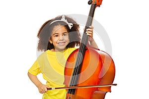 African girl plays violoncello with fiddlestick