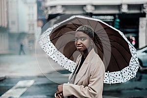 African girl with an umbrella, rain