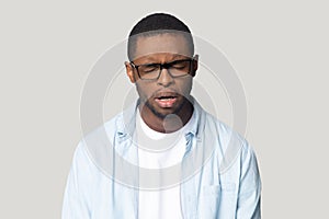 African guy crying whining feels lonely or offended studio shot