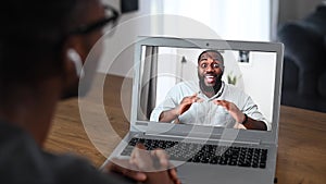 An African guy using laptop for video call